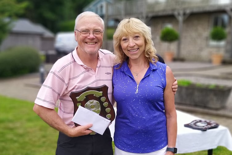 Ray Young receiving the shield from Rosie Sweet, Ladies’ Captain