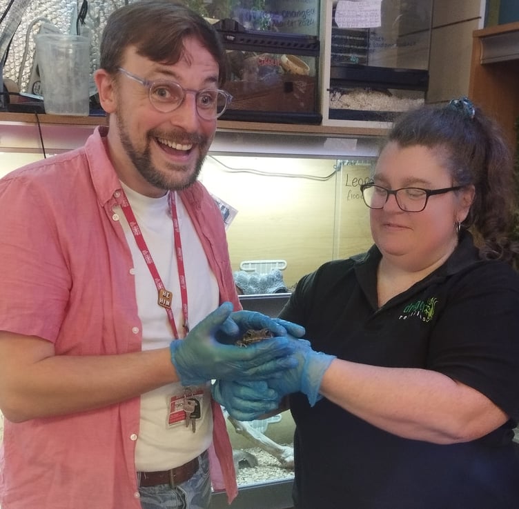 Tim Howe, Senior Manager Youth and Community at the Torch Theatre greeting 'Toad' with Claire Morris from Dragon Reptiles and Aquatics, Pembroke Dock.