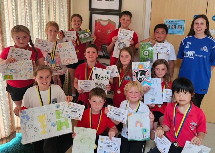 Winners of the Kilgetty AFC Centenary Design A Poster competition with Secretary and Girl’s Coach Sharron Hardwick.