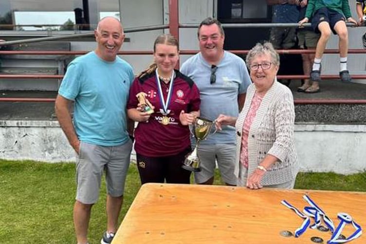 Player of the match Phoenix Phillips with Hilary Williams and sons Mark and Jonathan