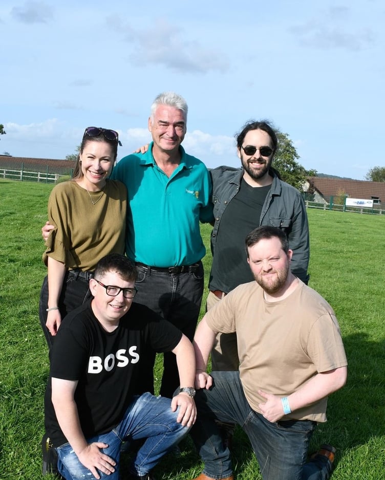 President of Narberth and Whitland Rotary Dr Paul Crawford with local band Sleeping Dogs