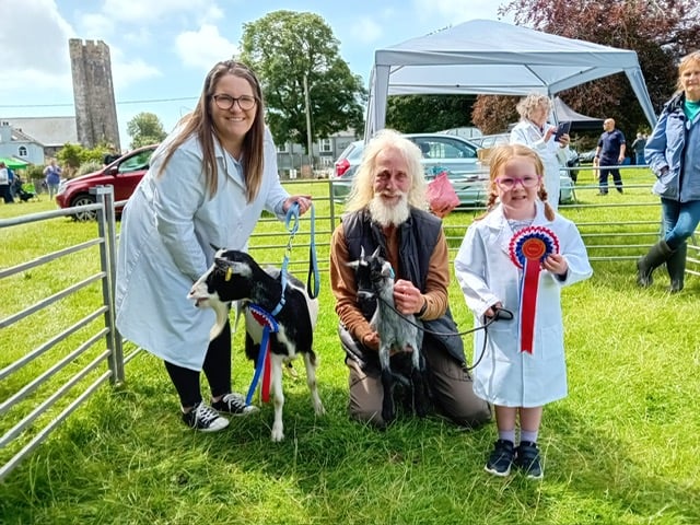 With the judge at Lamphey Show are Mari Arthur with her champion female kid, Nelle and Jac Arthur’s reserve champion female goat, Bounty.