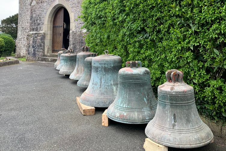 All eight bells lined up on the church path
