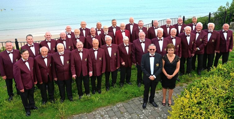 Members of Tenby Male Choir with musical director Paul Rapi and accompanist Jill Williams.