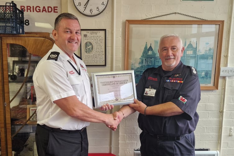 Euros Edwards being presented with his Certificate of Service at Crymych Fire Station, Pembrokeshire
