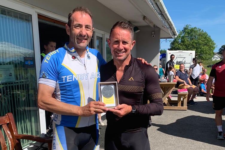 Gareth Huw Rees receiving Club with most finishers award on behalf of Tenby Aces from Shane Williams MBE