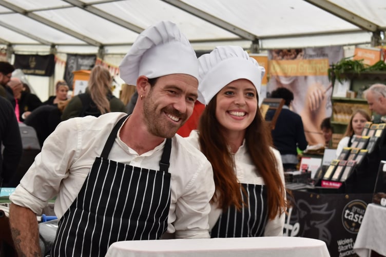 Two smiling chef entertainers (2023)