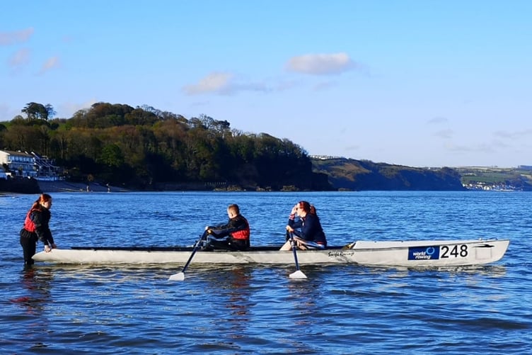 The young rowers take on a training session