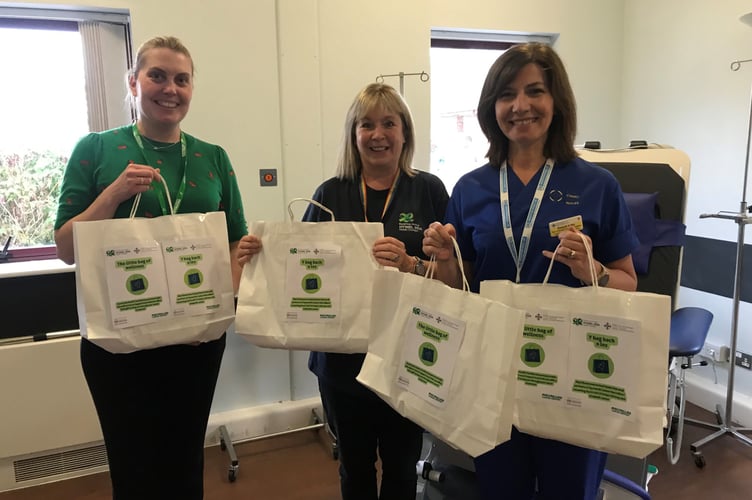 Staff with the wellness packs.