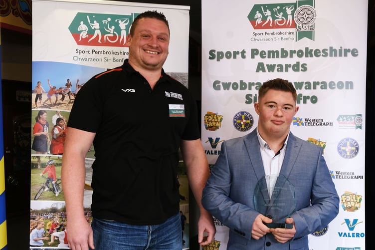 Powerlifter Bleddyn Gibbs (right) picked up the Disability Sport Award in 2023