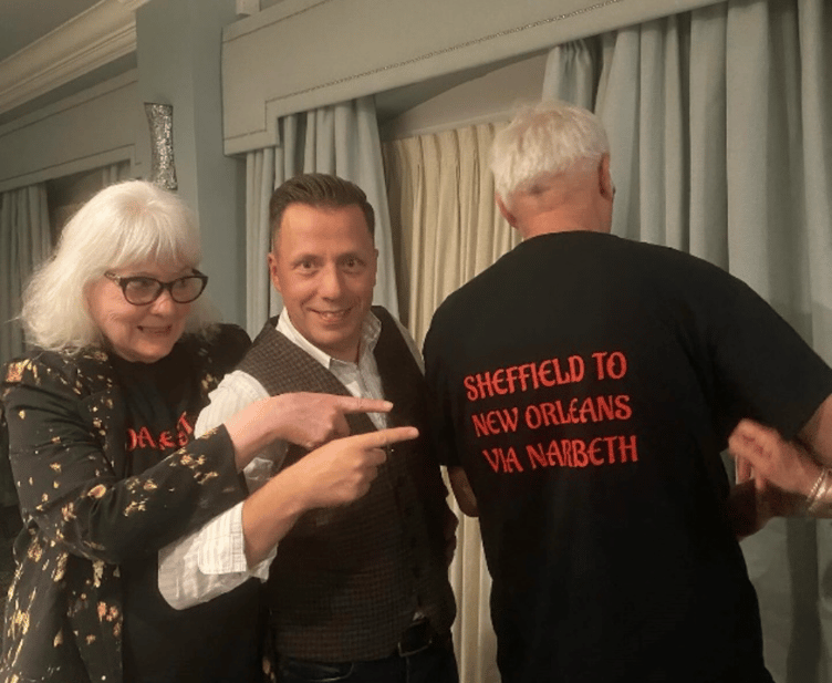 Dale Storr with two fans wearing suitable T-shirts