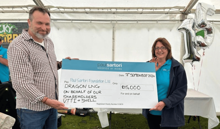 Dragon LNG and Dragon Energy MD, Simon Ames presenting the cheque to Sandra of Paul Sartori at Dragon’ staff and community celebration event.
