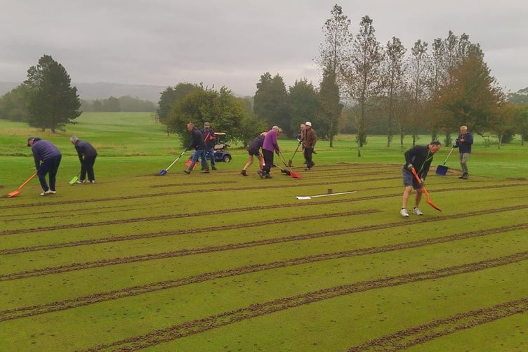 Hard at work on the greens