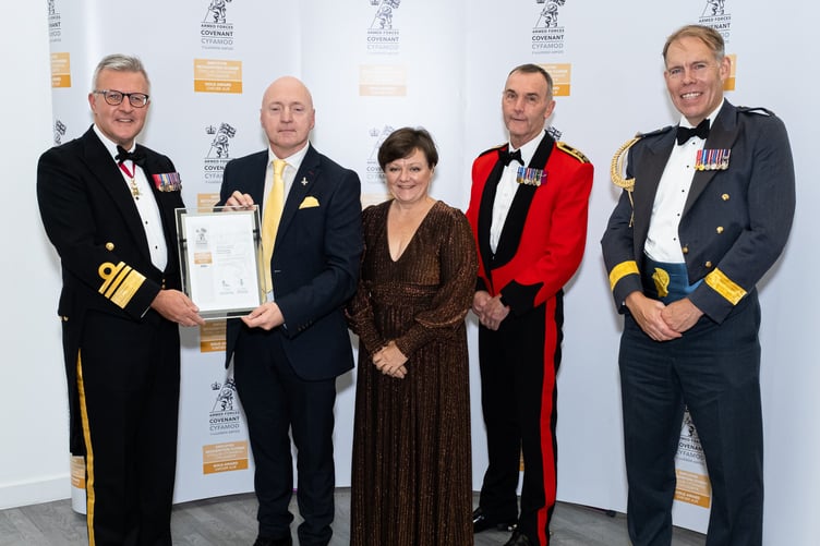 Presenting the Council’s Gold award to Cllr Simon Hancock, Member Champion for Armed Forces and Hayley Edwards, Regional Armed Forces Covenant Liaison Officer, are Vice Admiral Phil Hally CB MBE, Chief of Defence People, Colonel Sion Walker OBE, Deputy Commander 160th Wales Brigade, and Air Commodore Rob Woods OBE, Air Officer Wales.