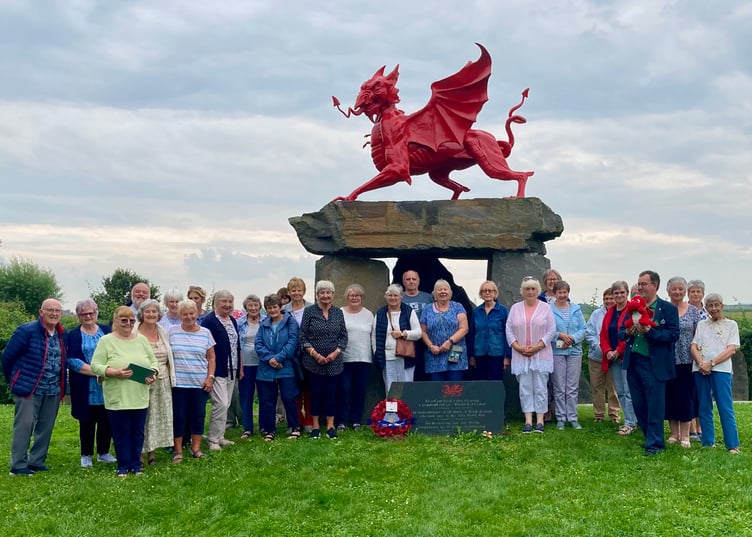 Tenby Travelarts visitors at the memorial in Langemark-Poelkapelle near Ypres, in memory of all those of Welsh descent who took part in the First World War. The memorial was sculpted by Lee Odishow and unveiled on August 16, 2014.