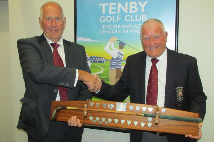 Ashburnham Captain Tony Evans (right) hands The Putter to Mick Seal of Tenby