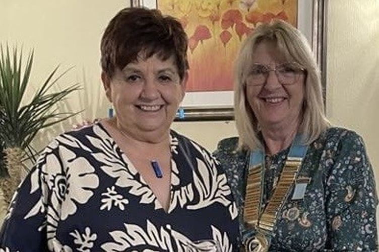 New WWLBA secretary and Autumn Cup winner Kath Blayney, seen left, receiving her trophy from immediate past president Mandy Jenkins