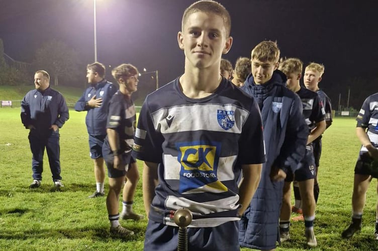 Dafydd with the prize for the team that wins the Scarlets Region in the national Dewar Shield competition. The sword is named the Cleddyf Glyndwr.