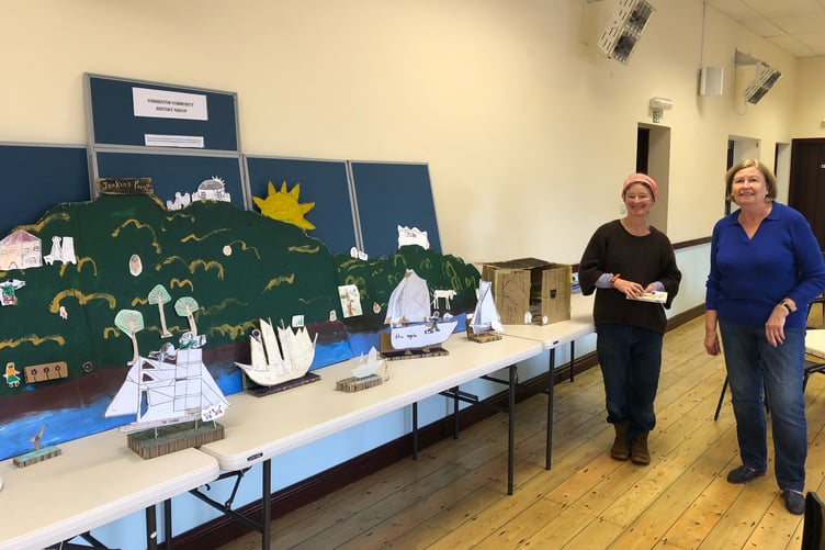 Pictured left Fran Evans and right Jan Howell Chair Cosheston Community History Group in front of the Cosheston School display