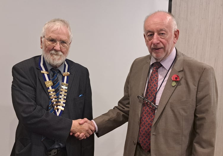 Peter Morgan (right) hands over the Probus Presidency to the incoming President, Patrick Jones