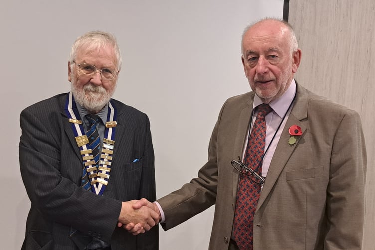 Peter Morgan (right) hands over the Probus Presidency to the incoming President, Patrick Jones