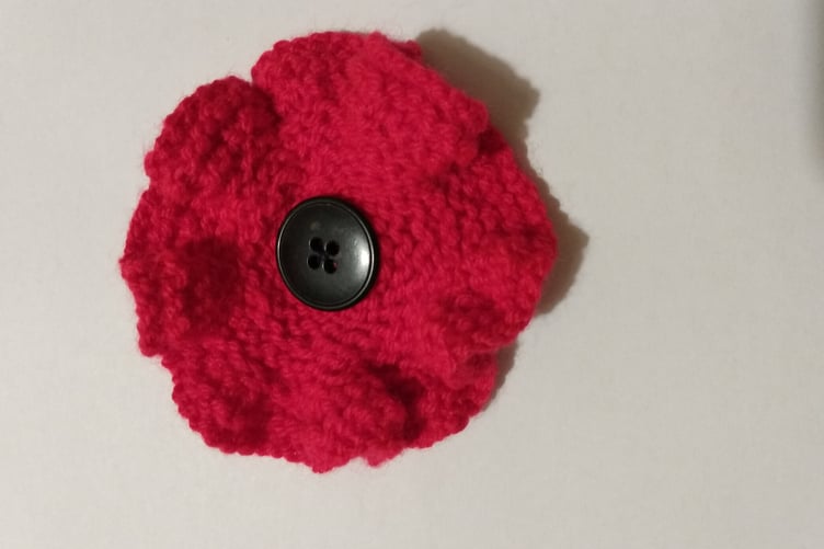 Knitted remembrance poppy