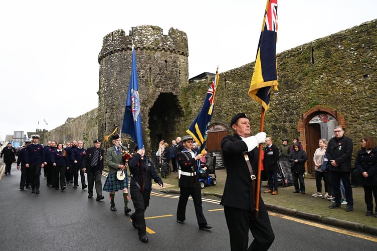 The Remembrance Sunday parade assembled outside St Mary’s Church to depart for the War Memorial alongside Tenby's historic town walls.