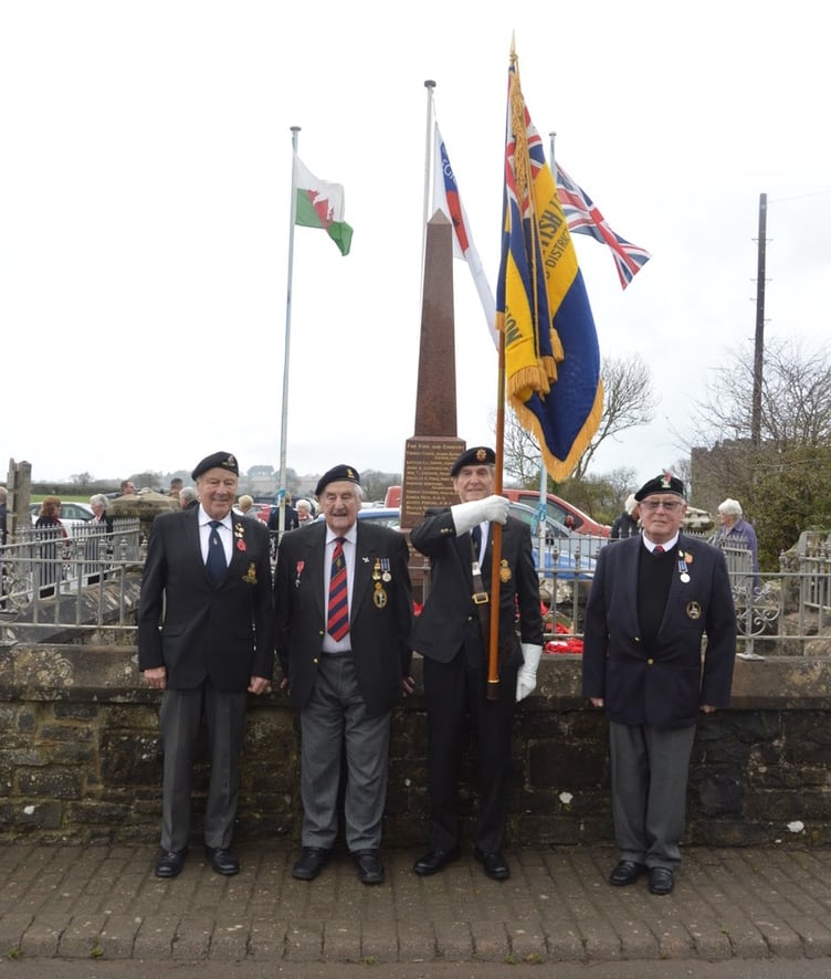 Pictured at the Carew War Memorial on Remembrance Sunday are members of the Cresselly and District British Legion, Standard Bearer Gerald Williams and Escorts Denzil Griffiths and Graham Roberts. With them is 97 year old Royal Signals Veteran John Brock MBE who during his service was attached to The Sudanese Defence Force.