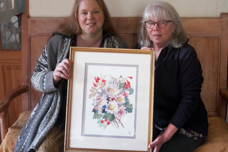 BACK HOME: Sarah and Suzie Williams, the granddaughter and daughter of artist Peggy Laws with the painting found in a local charity shop.