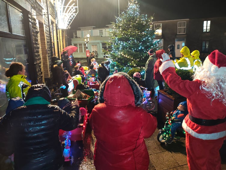 The street in Whitland was lit up when 15 children lit up and decorated their ‘wheels’ on November 29 - a fantastic sight for all those who braved the weather. They paraded to the town’s Christmas tree to meet Father Christmas at the lighting up ceremony.