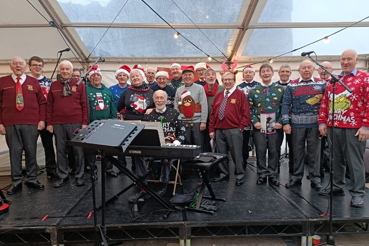 Pembroke and District Male Voice Choir brought seasonal cheer to Pembroke Castle’s Christmas Fayre, sporting a fine selection of Christmas sweaters, ties and Santa hats, accompanied by Rev’d William Lambert, who recently joined the ranks.