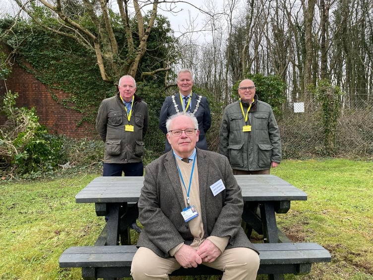 David Scheeres, Chairman. Haverfordwest Target Shooting Club – sitting. Behind Mr Scheeres are Cllr Jon Harvey, Leader of Pembrokeshire County Council, Cllr Martin Lewis, Mayor of Haverfordwest, and Senedd Member Paul Davies.