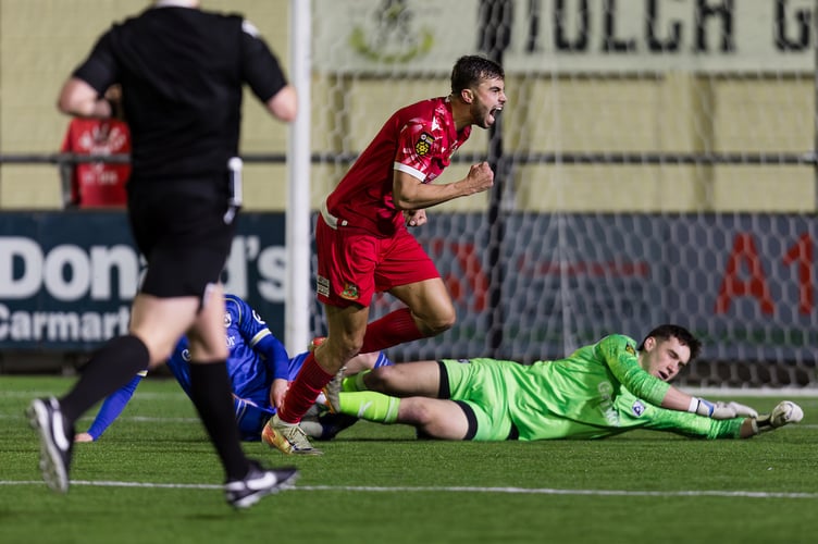 CARMARTHEN, WALES - 13 DECEMBER 2024: Llanelli's Ethan Cann scores and celebrates 0-2 during the 2024/25 JD FAW Welsh Cup round 4 fixture between Haverfordwest County AFC & llanelli Town AFC at LHP Stadium, Carmarthen, Wales.  (Pic by John Smith/FAW)
