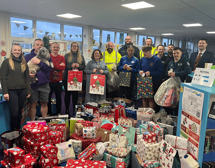 Gifts for children being presented to Pembrokeshire Action to Combat Hardship (PATCH) as a result of Haven School’s Tags on the Tree project
