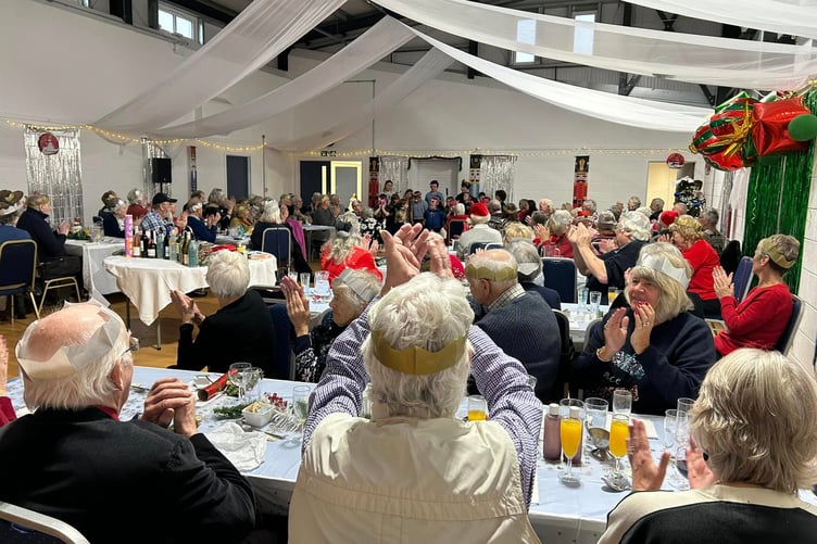 Guests at the Giraldus Centre were entertained by children from Manorbier Community School at the free Christmas lunch for over 65s