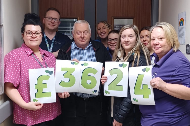Pictured above: Anwen Davies and Nigel Davies with staff from Cilgerran Ward.