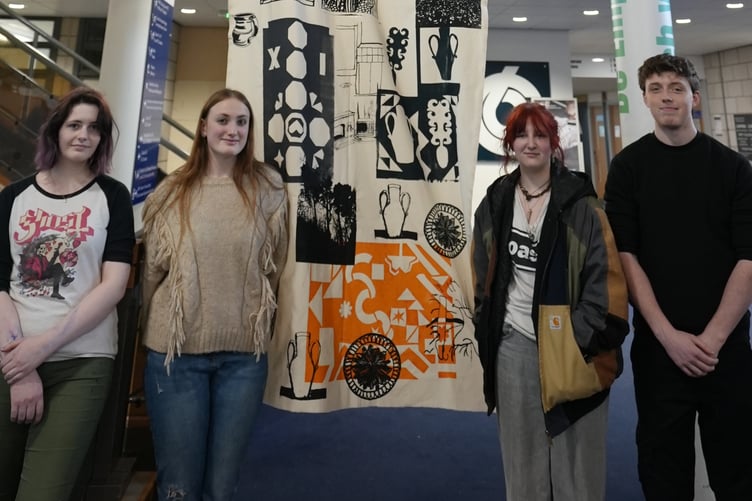 Pembrokeshire College Art and Design learners with the banner
