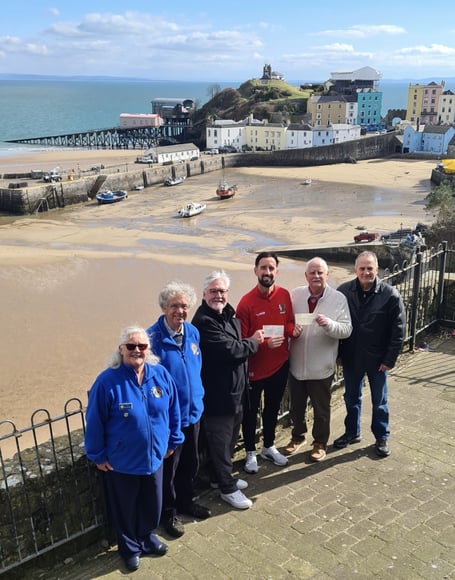Pictured at the cheque presentation are (from left); Julie Buckland (Lions Vice President), Andrew Mayes (Lions Treasurer), Roly Fury (Lions President), Adam Hughes, Tom Cullen (Tenby Rotary President) and Nick Stapleton (Lions) 