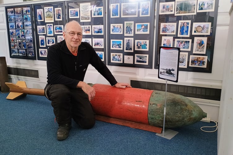 Diver Steve Jones with the Zalinski gun projectile at Pembroke Dock Heritage Centre