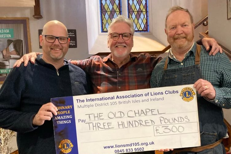 Ian Rees (right) receiving the donation from Tenby & District Lions