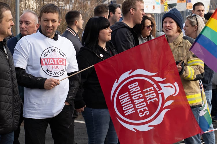 Over 200 firefighters and supporters gathered at a rally outside Mid and West Wales Fire and Rescue Service