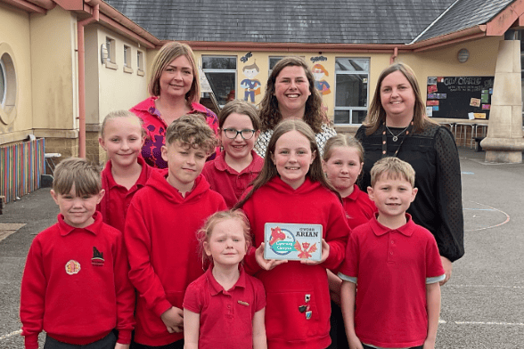 Pembrokeshire Local Authority's Catrin Phillips visited Narberth Community Primary School on Wednesday to present an award for achieving silver status in the Siarter Iaith. She is pictured here with Headteacher Mrs Kate Moore, Criw Cymraeg leaders Chloe Ormond and Meinir Lloyd and pupils in the Welsh and English streams.