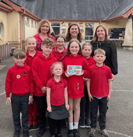 Pembrokeshire Local Authority's Catrin Phillips  visited Narberth Community Primary School on Wednesday to present an award for achieving silver status in the Siarter Iaith. She is pictured here with Headteacher Mrs Kate Moore, Criw Cymraeg leaders Chloe Ormond and Meinir Lloyd and pupils in the Welsh and English streams.