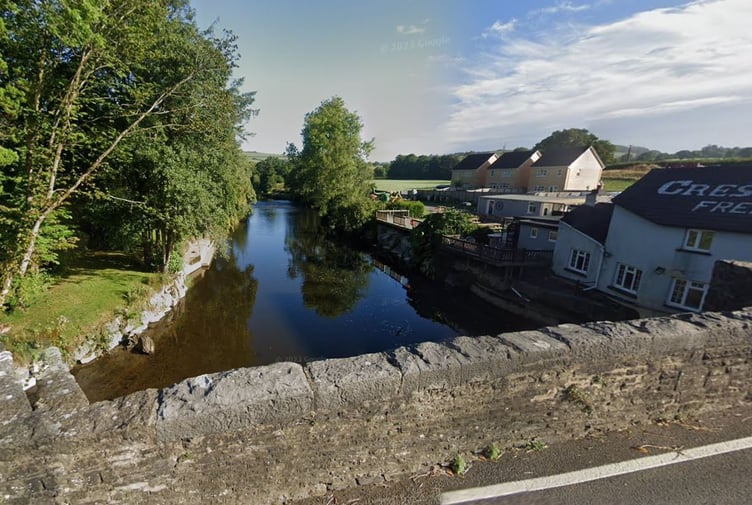 The grade two-listed bridge over the River Cothi, Pontargothi, Carmarthenshire (Google Maps and free for use)