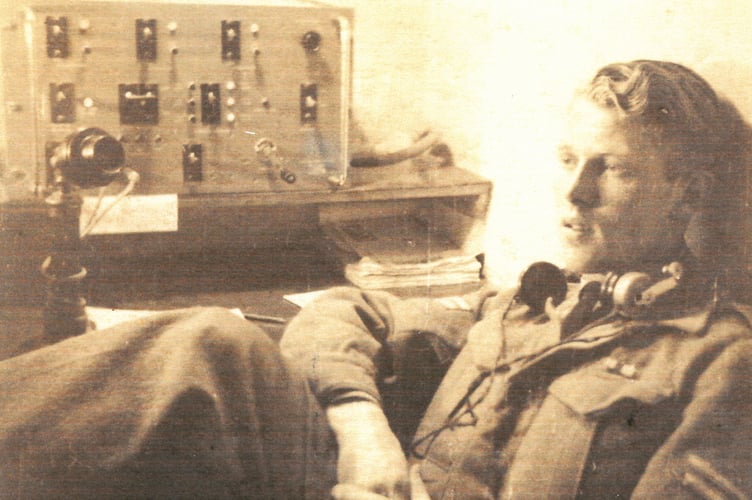 Dennis Tidswell by his VHS-DF set in RAF HQ at Valetta, Malta, c.1943. (credit: Dennis Tidswell, via West Wales Veterans’ Archive)