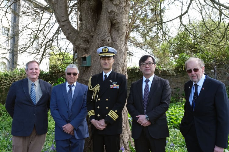 Mr Masaki Ikegami and Captain Shuzo Homma from the Japanese Embassy pictured by the Ginkgo tree in the grounds of the Master Shipwright’s House with the owner, Mr Stewart Walton (left), and Rik Saldanha and John Evans of the Pembroke Dock Heritage Trust.