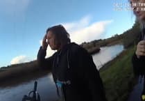 Police speak to Nerys Lloyd at riverside as paddleboarding tragedy unfolds