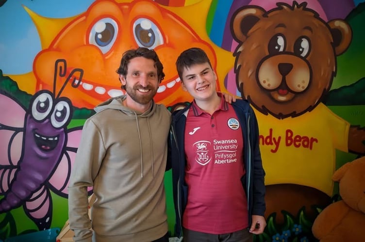 Sandy Bear Children's Bereavement Charity in Pembrokeshire recently had the privilege of welcoming Welsh football star Joe Allen to its HQ, where he met inspiring youngster fifteen-year-old Connor Williams, whose dad sadly passed away suddenly and unexpectedly last year. 