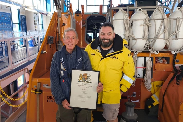 Dicky, pictured with his son Jon, Deputy Coxswain at Tenby’s lifeboat station, who has proudly followed in his father’s footsteps through both the fire service and the RNLI. 