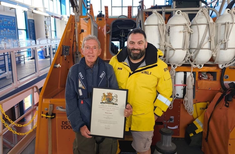 Dicky, pictured with his son Jon, Deputy Coxswain at Tenby’s lifeboat station, who has proudly followed in his father’s footsteps through both the fire service and the RNLI.